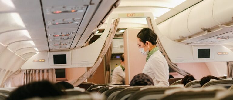a cabin crew/ flight attendent/ airhostess is on duty in flight